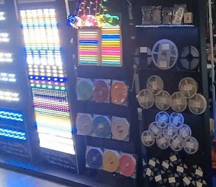 LED strips and reels glowing on a rack